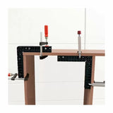 Woodworking corner clamps and bar clamps securing wooden boards for joinery