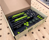 Bow low pro clamps set with accessories in an open box on a workbench