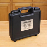 Plastic carrying case labeled Premium Quality Forstner Bit Set on wood workbench