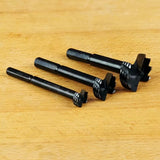 Set of three Forstner drill bits for woodworking on wooden surface