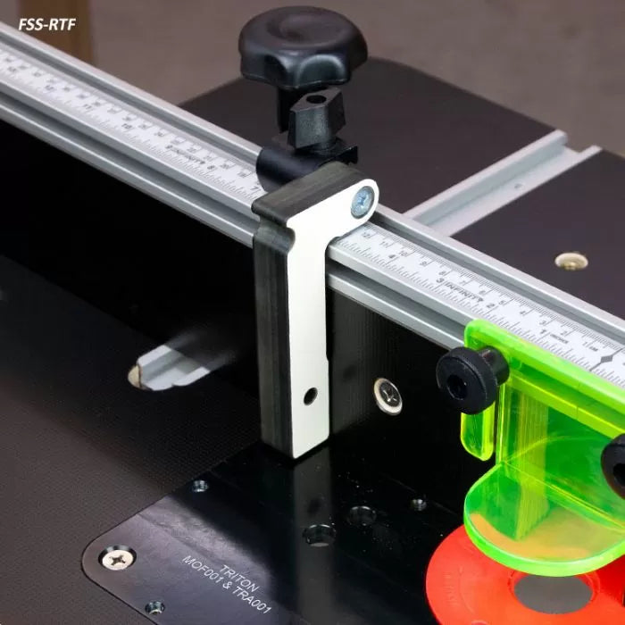 Router table fence with ruler guide and clear acrylic safety guard for woodworking precision.