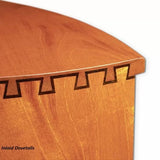 Close-up of a wood joint with precise inlaid dovetails on a light-colored wooden box