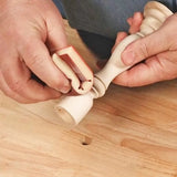 Hand sanding intricate wood spindle on workbench with flexible sanding tool