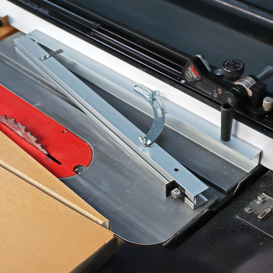 Table saw with red blade, aluminum miter gauge, and woodworking fence setup