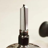 Close-up of straight carbide router bit installed in a router tool for woodworking.