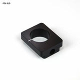 Black metal woodworking jig stop block with center hole on white background