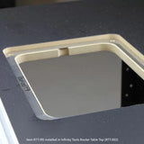 Router table insert plate installed in a black woodworking router table top.