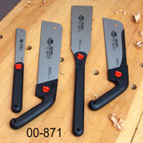 Set of four Japanese pull saws with black handles on a woodworking bench