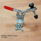 VRS-200.CC toggle clamp kit with red handle, mounting screws, and nuts on wood surface